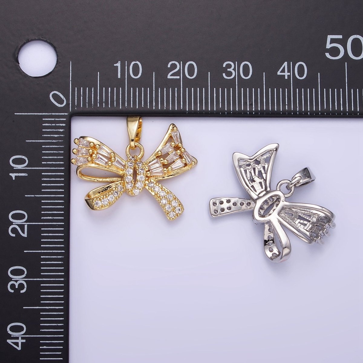 14K Gold plated Micro Paved CZ Baguette Ribbon Bow Pendant in Gold & Silver | AA1156 - DLUXCA