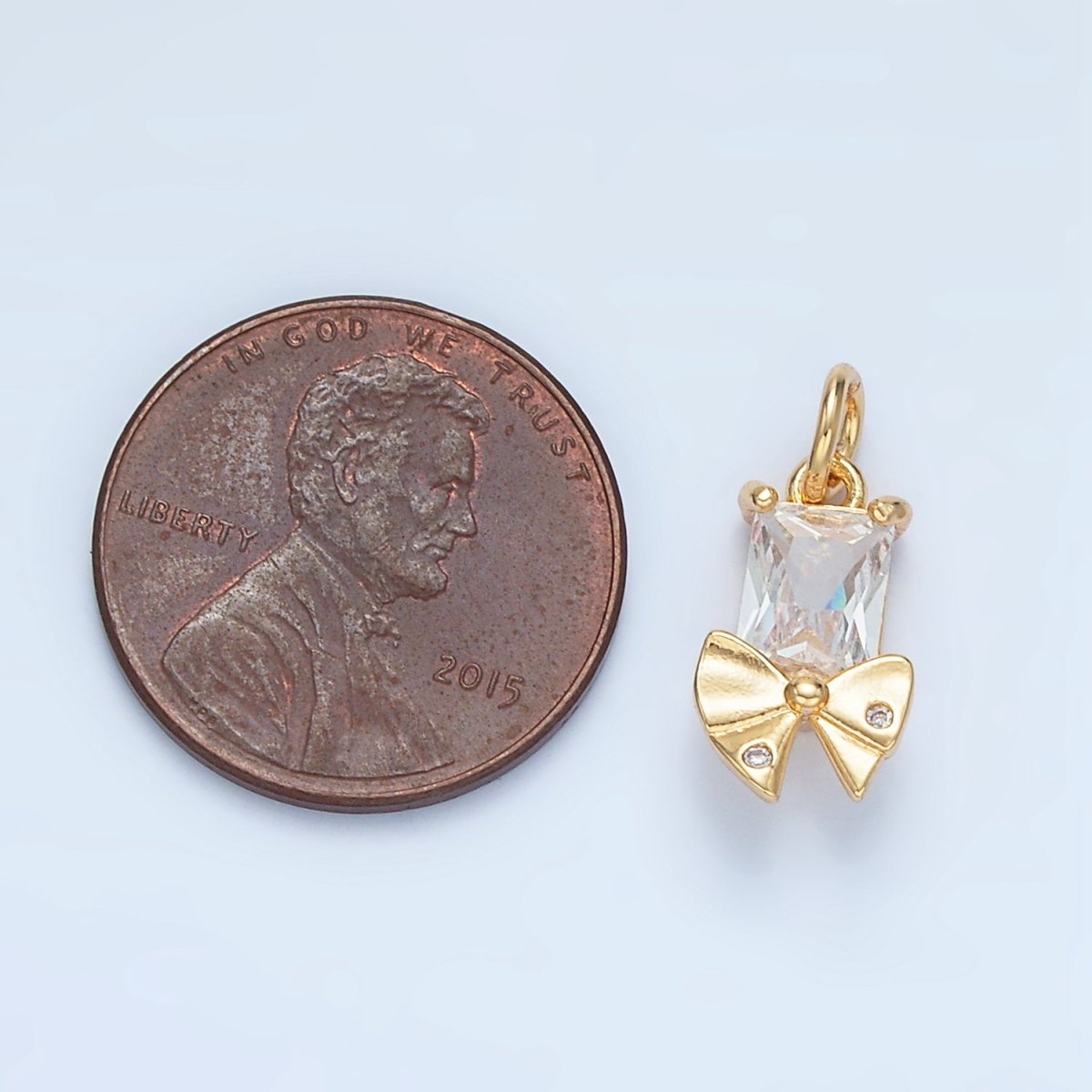 24K Gold plated Clear CZ Baguette Dotted Ribbon Bow Charm | X282 - DLUXCA