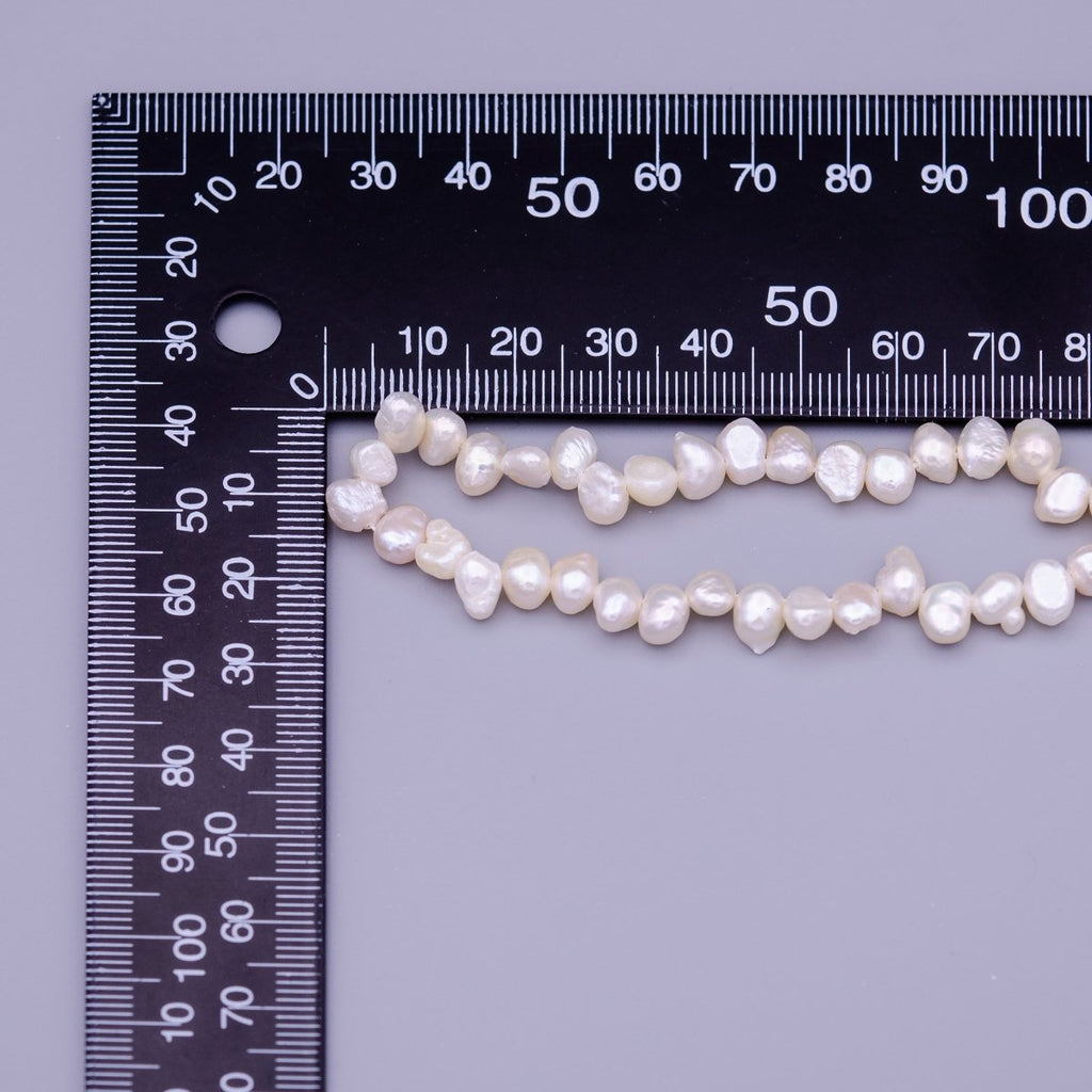 6.7mm - 7.6mm Nugget Seed White Natural Freshwater Pearl 71pcs Full Strand | WA-1317 Clearance Pricing - DLUXCA