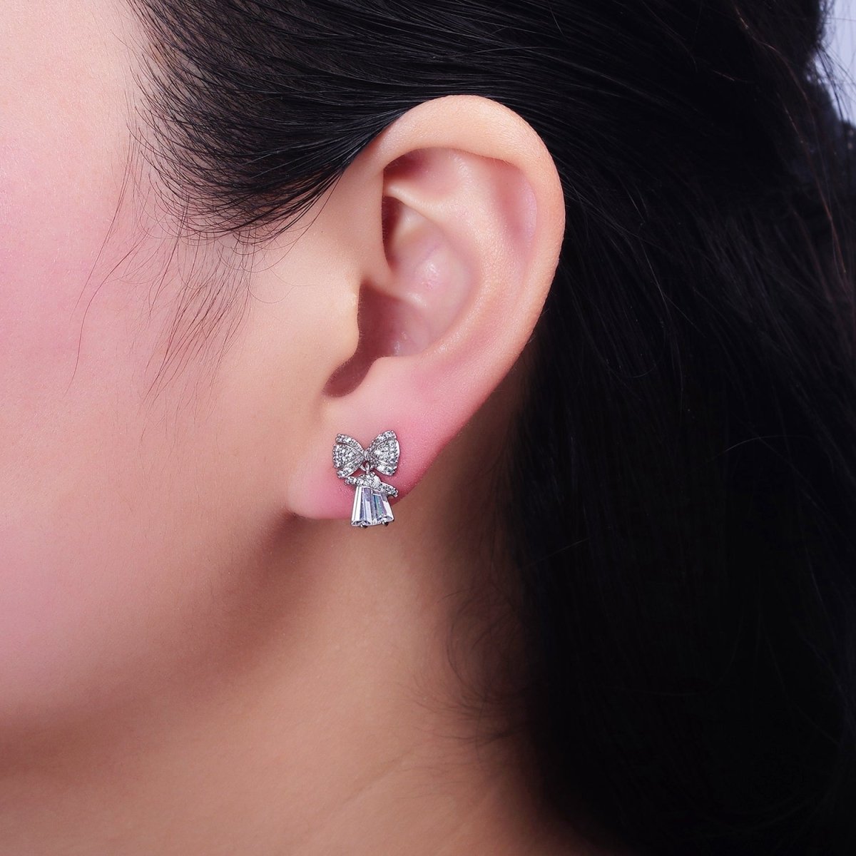 White Gold plated Micro Paved CZ Ribbon Clear Baguette Bell Stud Earrings | AD1454 - DLUXCA